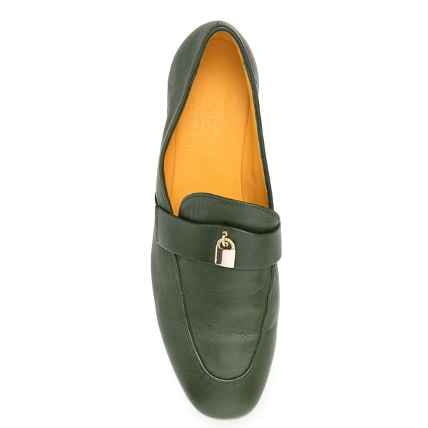 Green loafer shoe with gold buckle on a white background