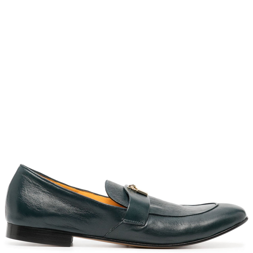 Green leather loafer shoe on a white background