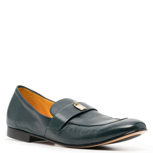 Green leather loafer with a gold buckle on a white background