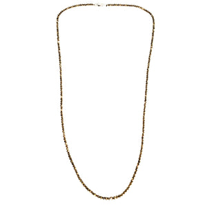 Gold chain necklace on a white background