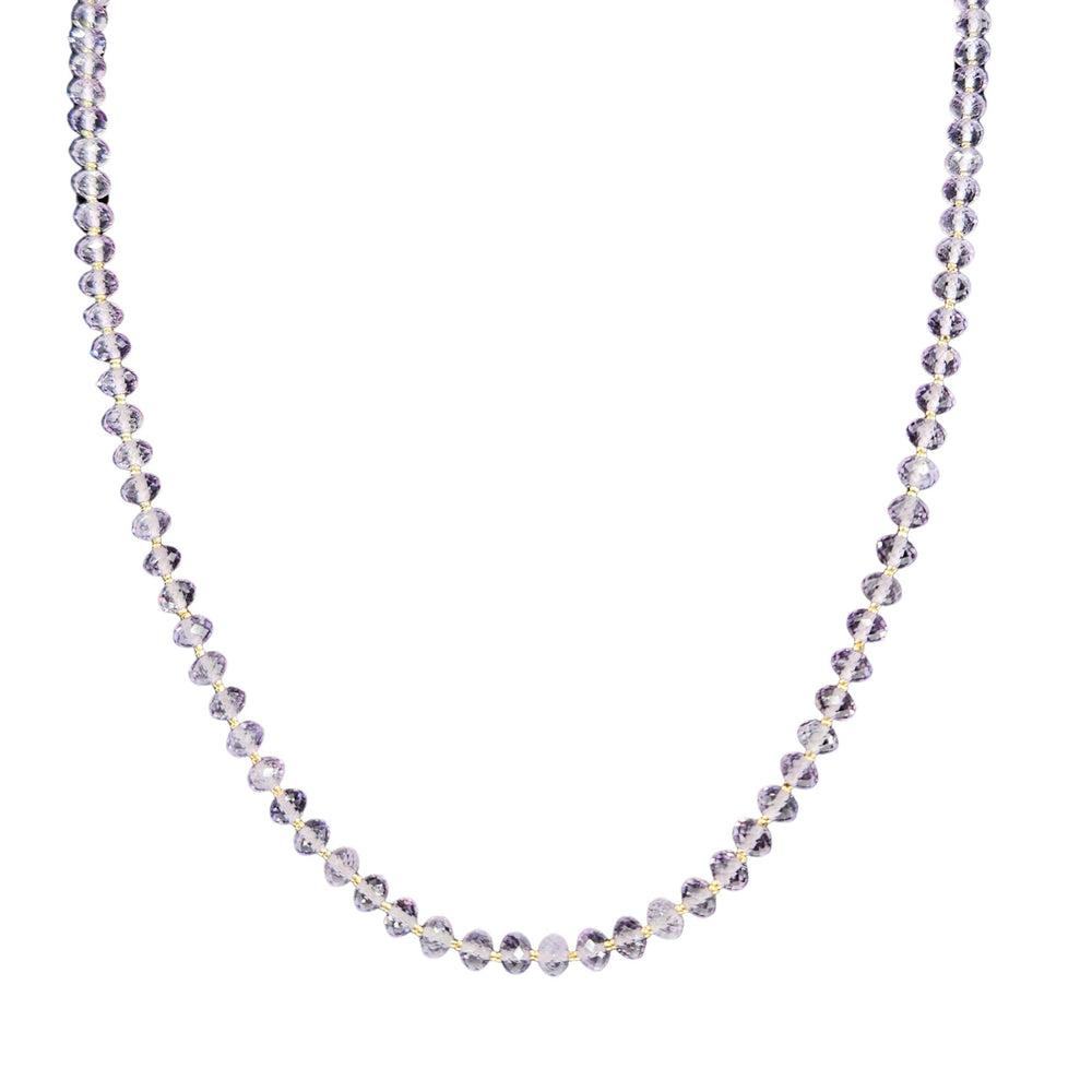 Necklace with small, round, faceted beads on a white background