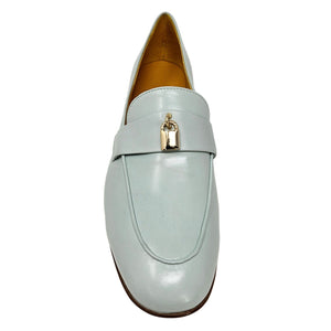Light blue loafer with a gold buckle on a white background