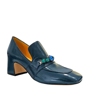 Blue shoe with decorative elements on a white background