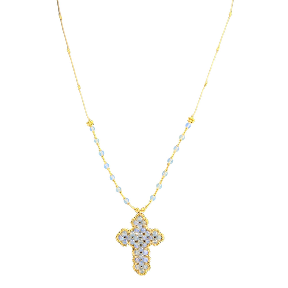 Gold necklace with a cross pendant on a white background