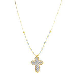 Gold necklace with a cross pendant on a white background