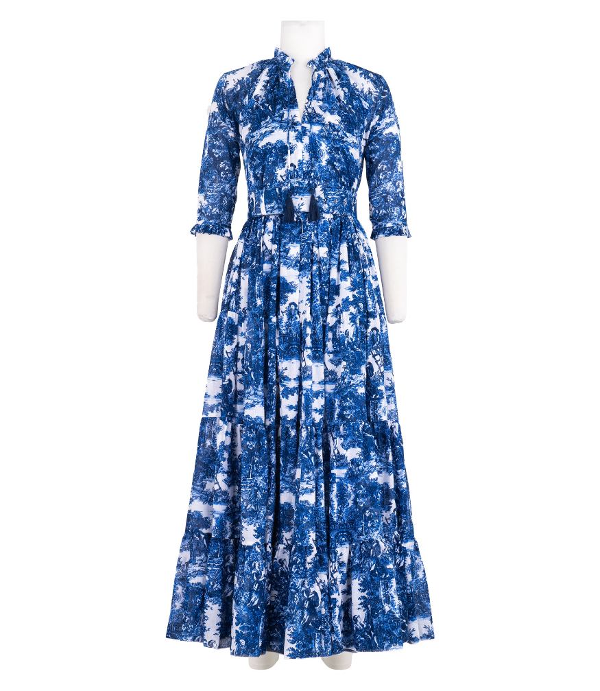 A knee-length dress with a collared neckline, three-quarter sleeves, and a flared skirt. Features a bold allover abstract pattern and fitted waist.