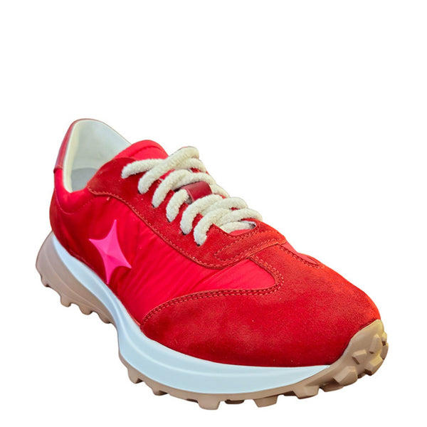 Red sneaker with a pink star on a white background