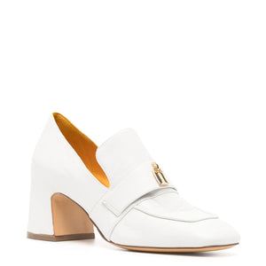 White shoe with gold accents on a white background