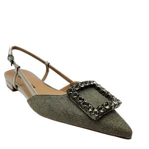Green pointed-toe flat shoe with embellished buckle on a white background