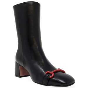 Black boot with a red buckle on a white background