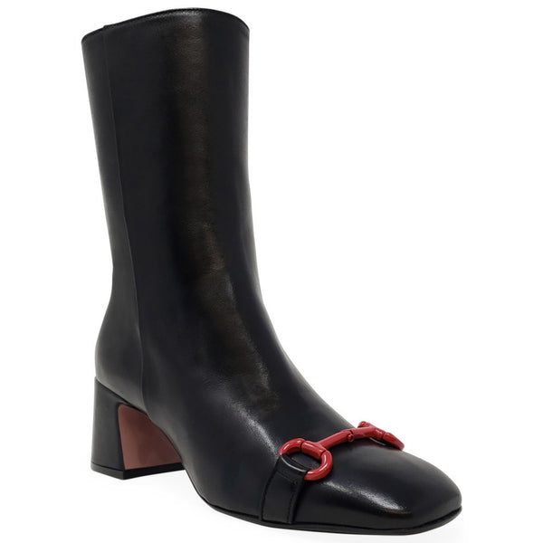 Black boot with a red buckle on a white background