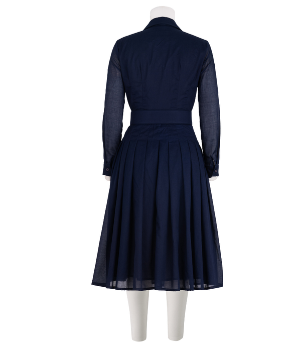A knee-length dress with a collared neckline, three-quarter sleeves, and a flared skirt. Features a bold allover abstract pattern and fitted waist.