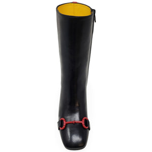 Black knee-high boot with red buckle on a white background