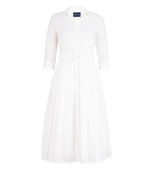 A knee-length dress with a collared neckline, three-quarter sleeves, and a flared skirt. Features a bold allover abstract pattern and fitted waist.