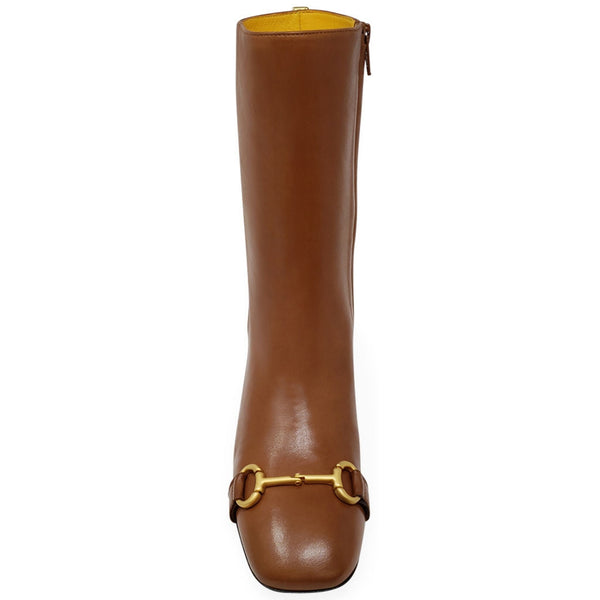 Brown leather boot with gold buckle on a white background