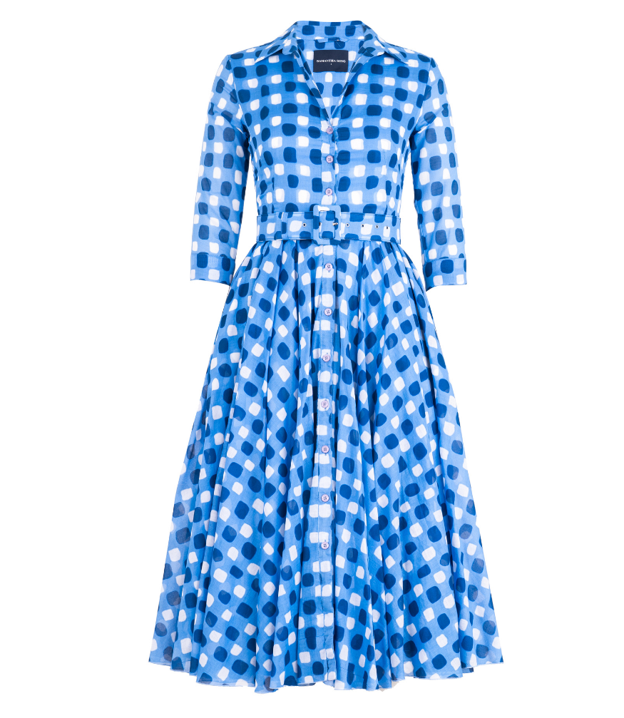 A knee-length dress with a collared neckline, three-quarter sleeves, and a flared skirt. Features a bold allover abstract pattern and fitted waist.