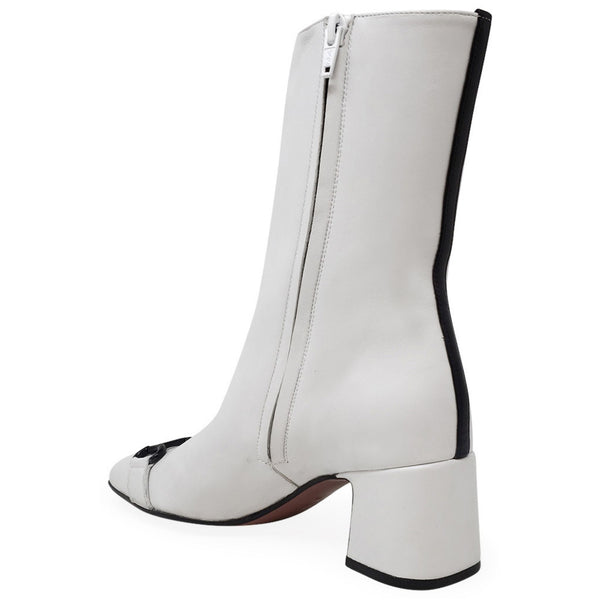 White boot with black trim on a white background