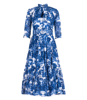 A knee-length dress with a collared neckline, three-quarter sleeves, and a flared skirt. Features a bold allover abstract pattern and fitted waist.