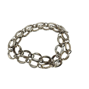 Silver chain bracelet on a white background