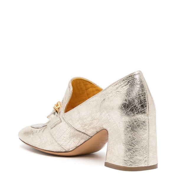 Silver metallic high-heeled shoes on a white background