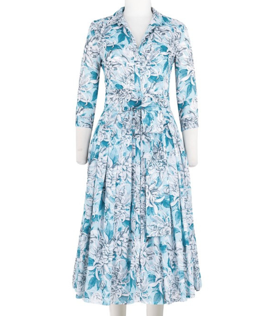 A knee-length dress with a collared neckline, three-quarter sleeves, and a flared skirt. Features a bold allover abstract pattern and fitted waist.
