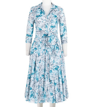 A knee-length dress with a collared neckline, three-quarter sleeves, and a flared skirt. Features a bold allover abstract pattern and fitted waist.