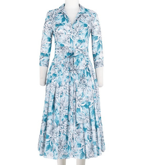 A knee-length dress with a collared neckline, three-quarter sleeves, and a flared skirt. Features a bold allover abstract pattern and fitted waist.