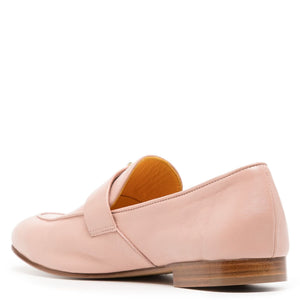 Pink loafer shoe with a brown sole on a white background