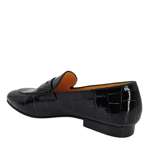 Black crocodile-patterned loafer shoe on a white background