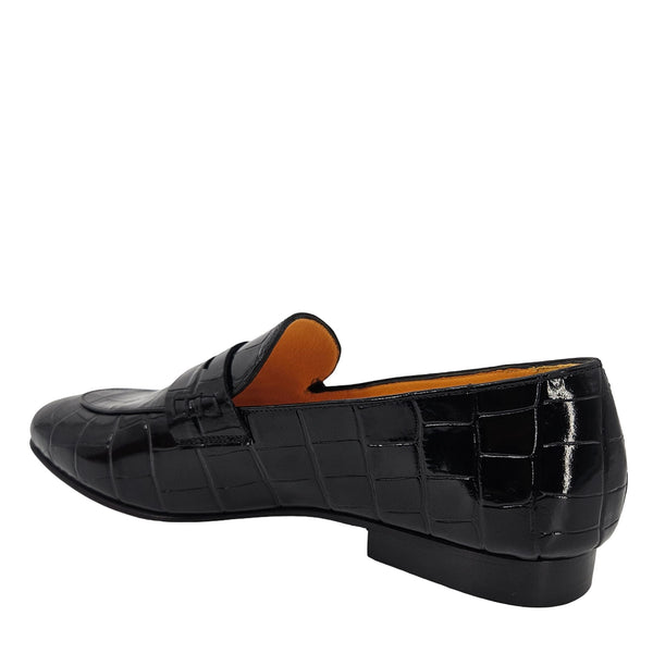 Black crocodile-patterned loafer shoe on a white background