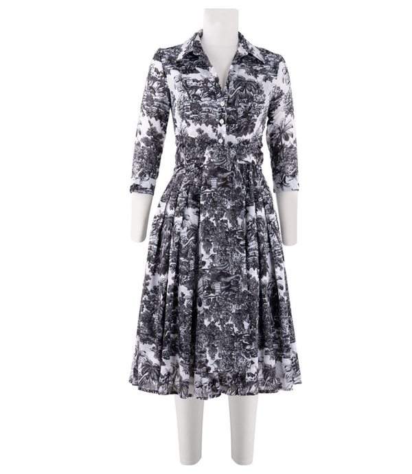 A knee-length dress with a collared neckline, three-quarter sleeves, and a flared skirt. Features a bold allover abstract pattern and fitted waist.
