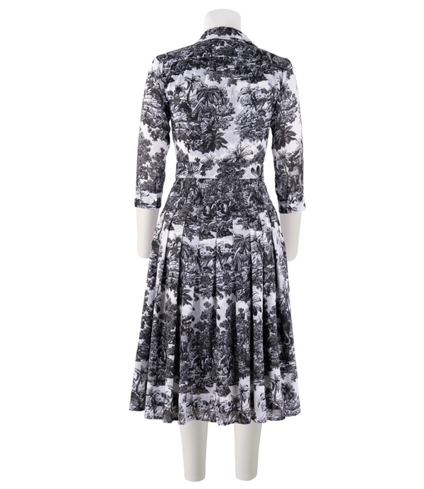 A knee-length dress with a collared neckline, three-quarter sleeves, and a flared skirt. Features a bold allover abstract pattern and fitted waist.
