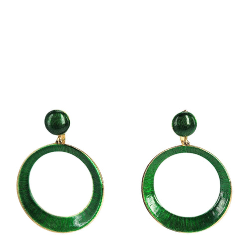 Green circular earrings on a white background