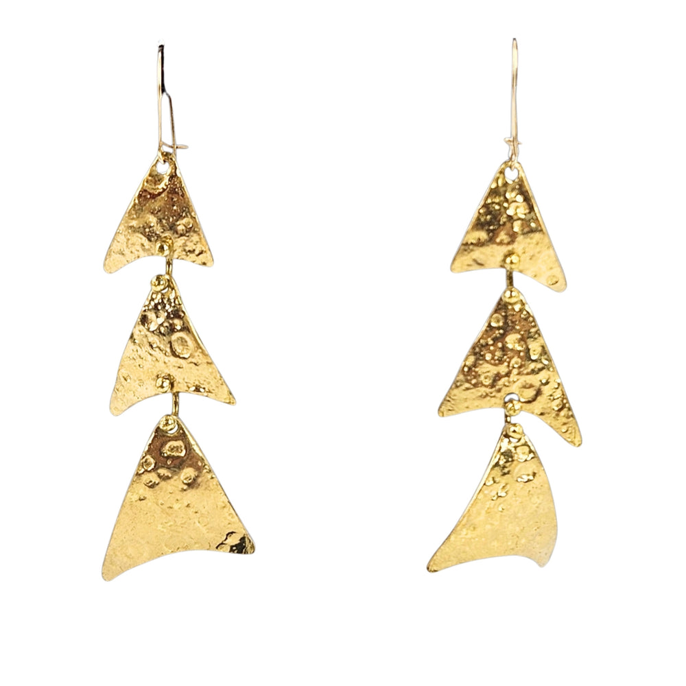 Pair of gold triangle earrings on a white background