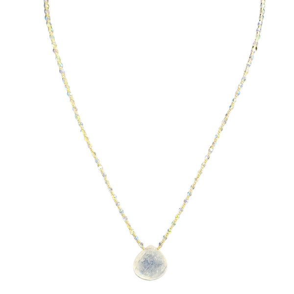 Necklace with a round, textured pendant on a thin chain against a white background