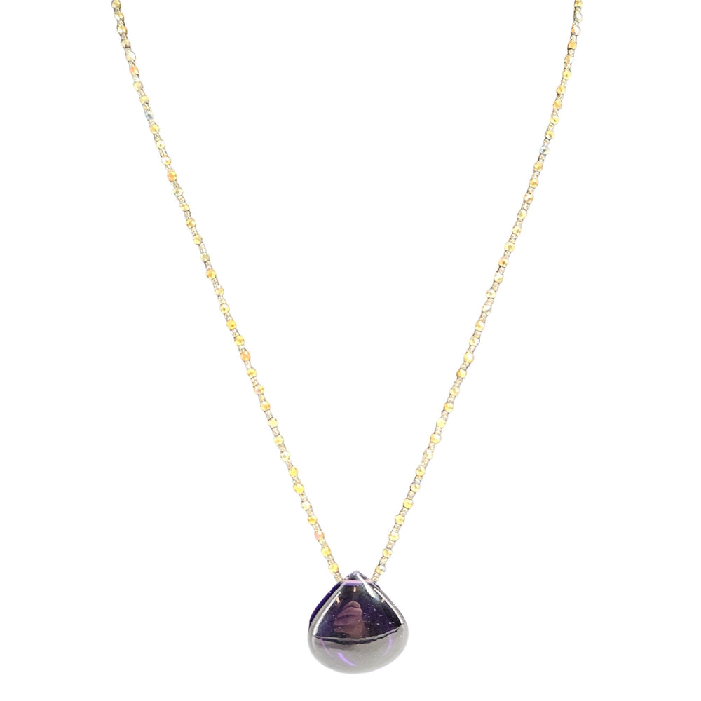 Necklace with a purple teardrop pendant on a white background