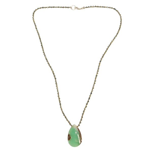 Necklace with a green pendant on a white background