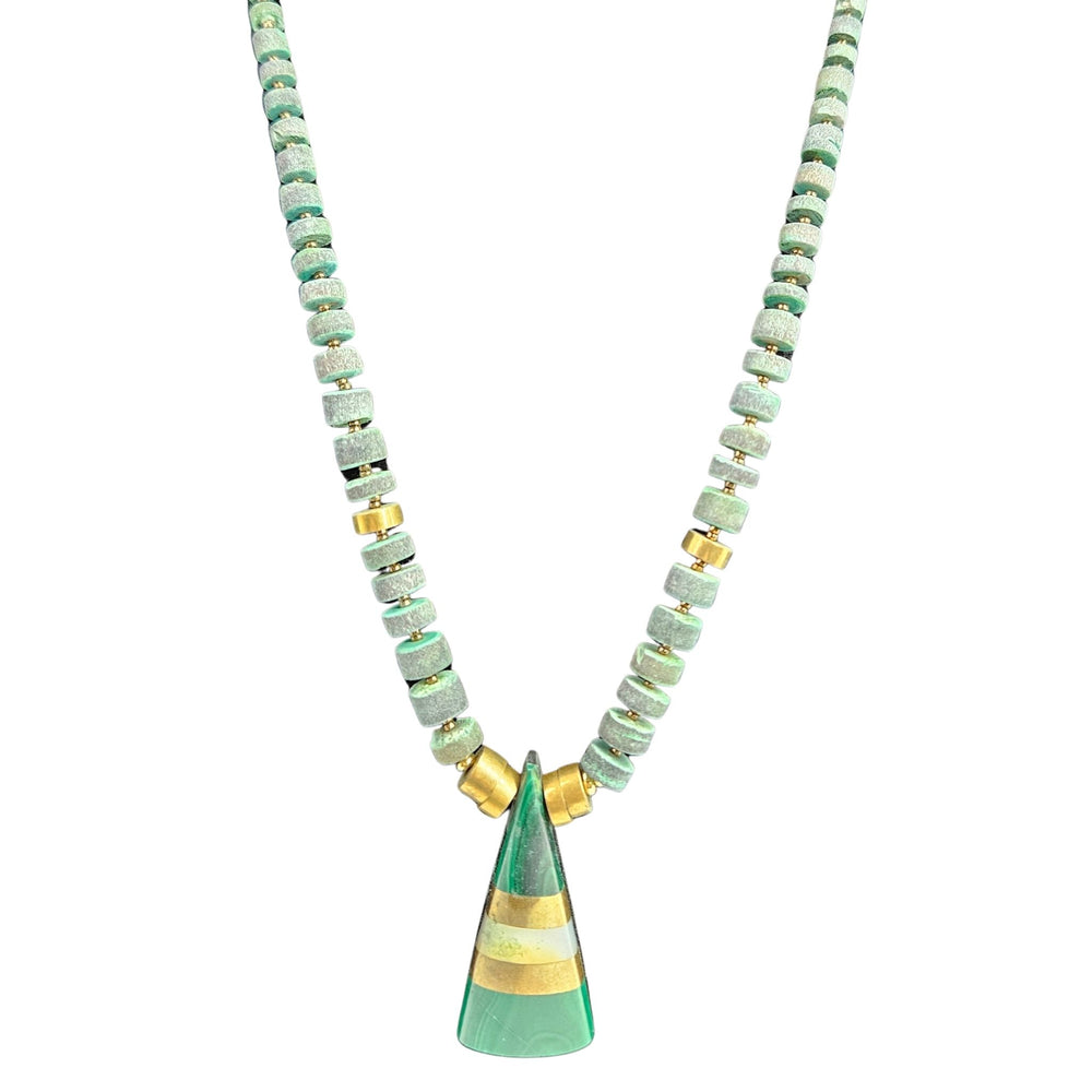 Necklace with green and gold pendant on a white background
