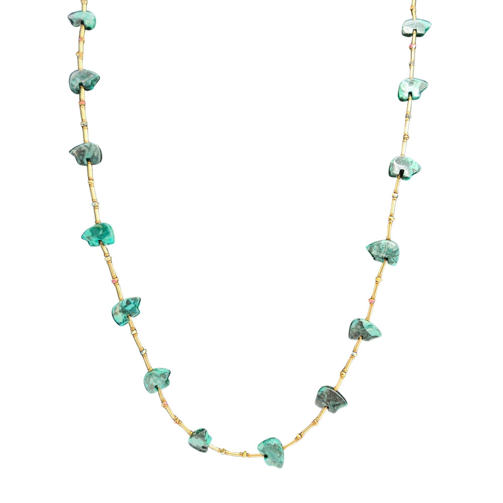 Necklace with green gemstones on a white background