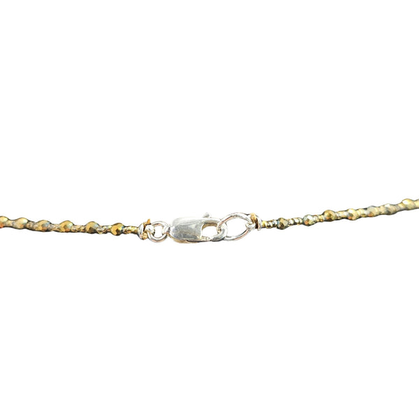 Gold and silver chain bracelet on a white background