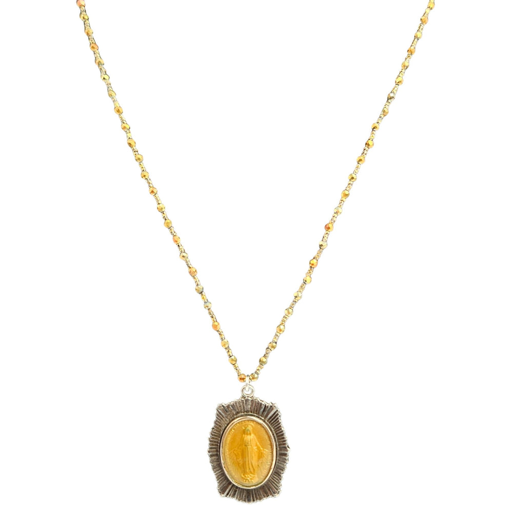 Gold necklace with a pendant on a white background