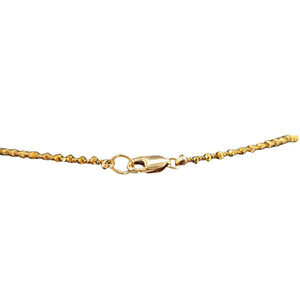 Gold chain bracelet on a white background