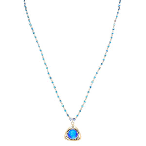 Necklace with a blue pendant on a white background