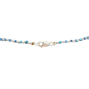 Multicolored beaded bracelet with a clasp on a white background