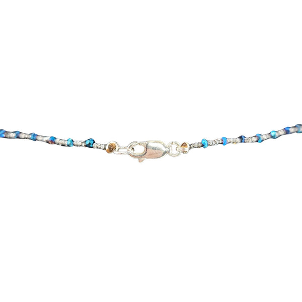 Multicolored beaded bracelet with a clasp on a white background