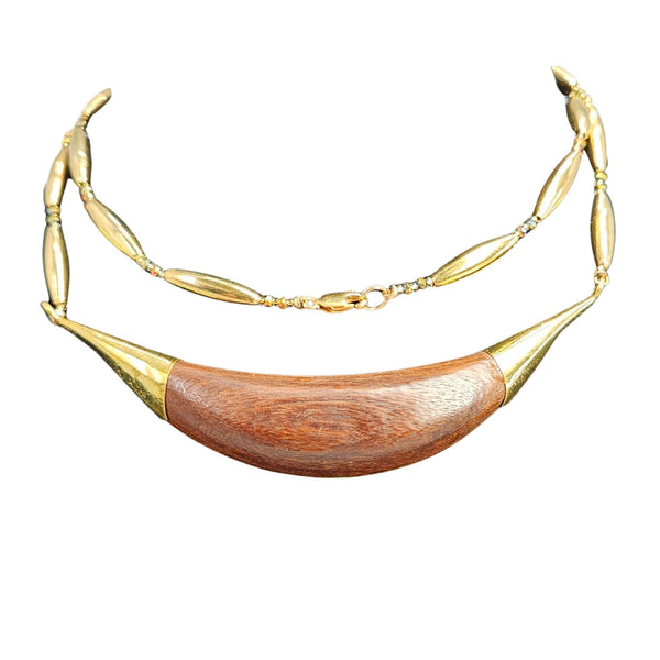 Necklace with gold and wooden design on a white background
