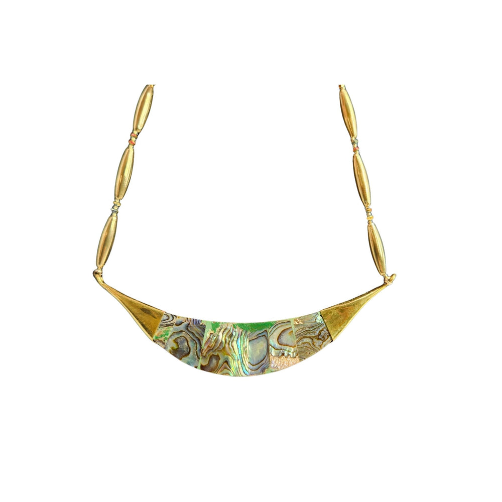 Gold necklace with a green and gold patterned pendant on a white background