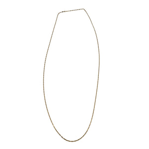 Gold chain necklace on a white background