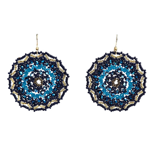 Pair of beaded earrings with blue and black pattern on a white background