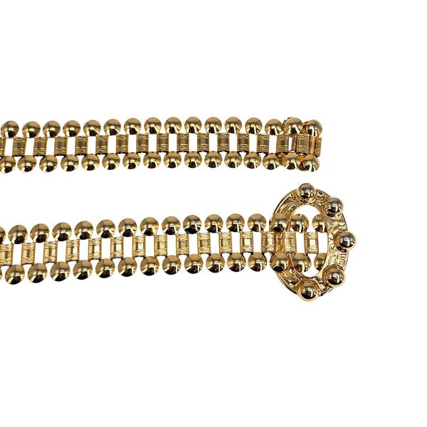 Gold chain belt with decorative clasp on a white background